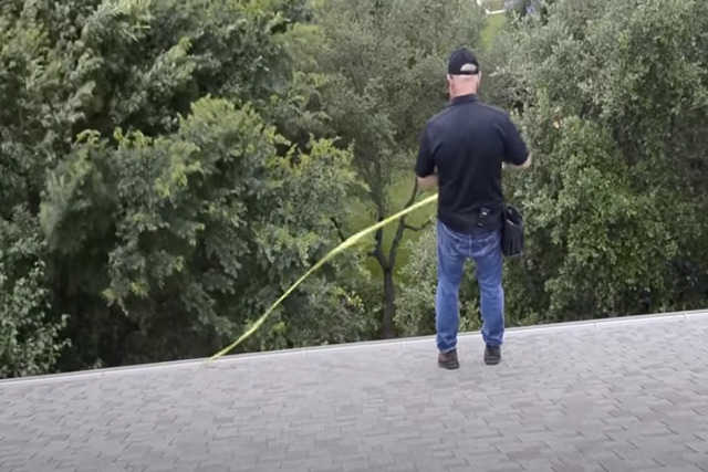 Specialist doing roof inspection