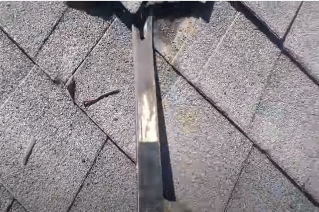 Carmel Roofing worker repairing a damaged shingles